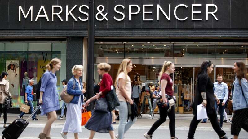 Shoppers walk past a Marks & Spencer shop on Oxford Street (Image: AFP/Getty Images)