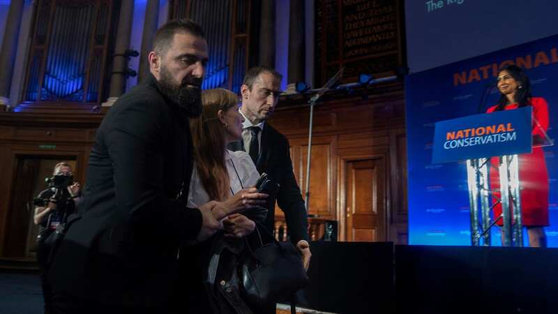 Two protesters dragged out after disrupting Suella Braverman immigration speech
