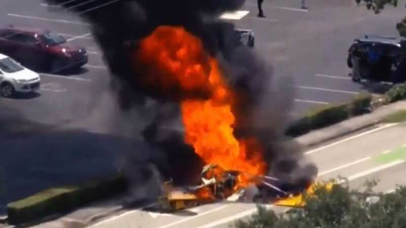 Plane towing sign plummets from sky and explodes into fireball in city streets