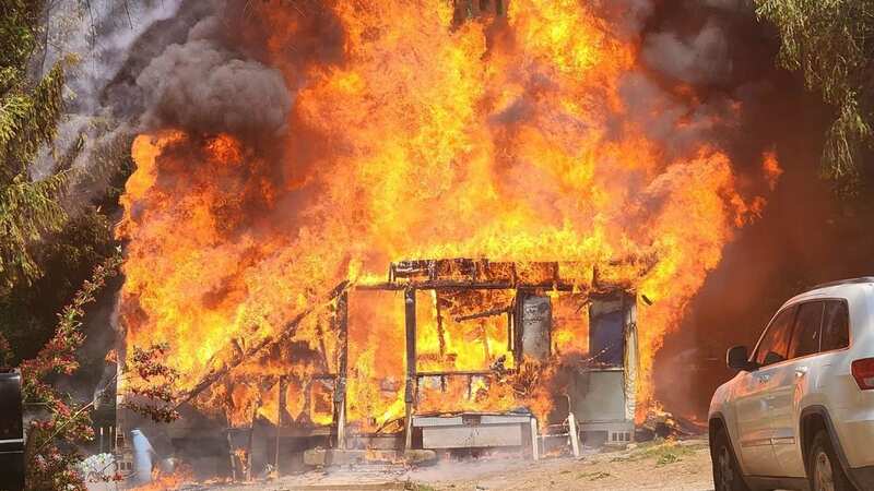 People were forced to escape as the home became engulfed in flames (Image: Facebook/Jackson County WV Sheriff