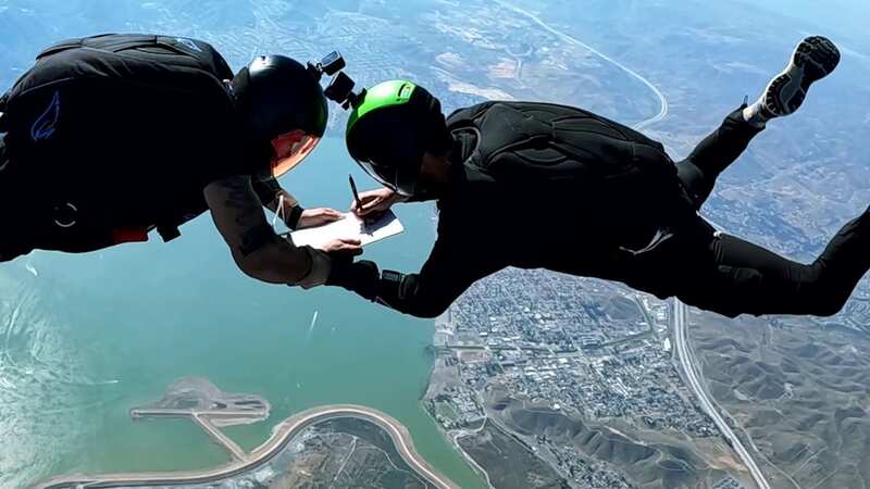 Video shows jobseeker signing new job contract - while tumbling through mid-air