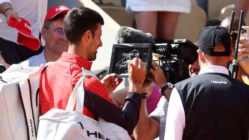 Novak Djokovic wrote a political statement on the camera lens about tensions between Kosovo and Serbia