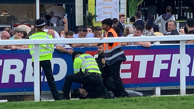 Protestor detained by police at Epsom Derby after running onto racecourse