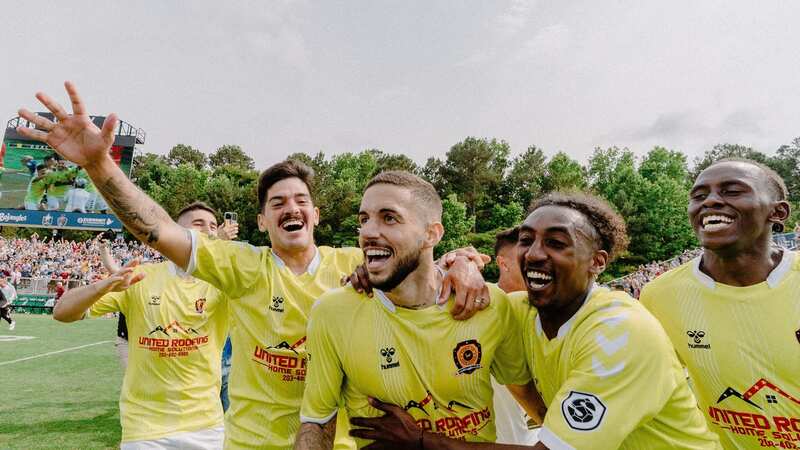 Amateur players from Newtown Pride celebrate after beating the likes of Borussia Dortmund to the TST (The Soccer Tournament) prize.