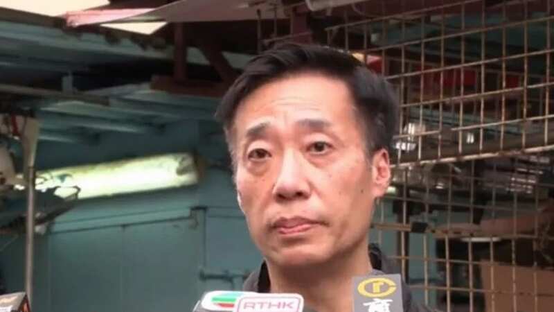 Police giving a statement outside the apartment (Image: Police, via Facebook screenshot)