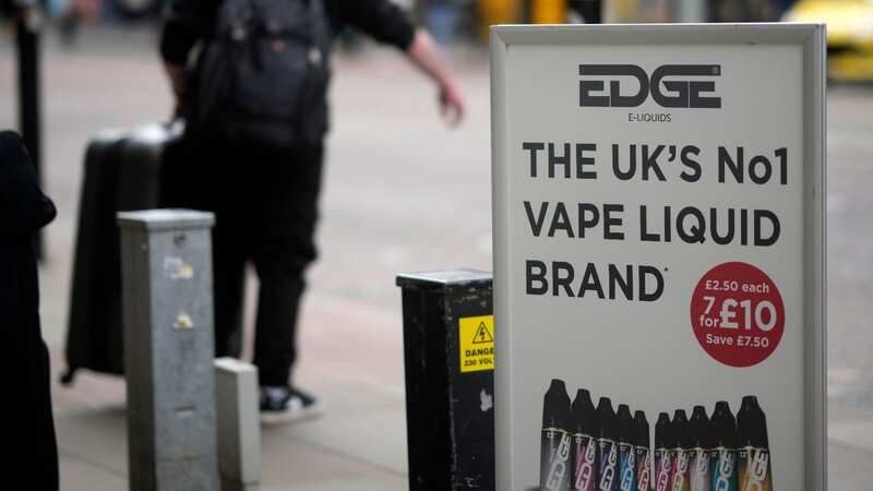 Advertising boards promote vaping devices outside a shop in Manchester (Image: Getty Images)