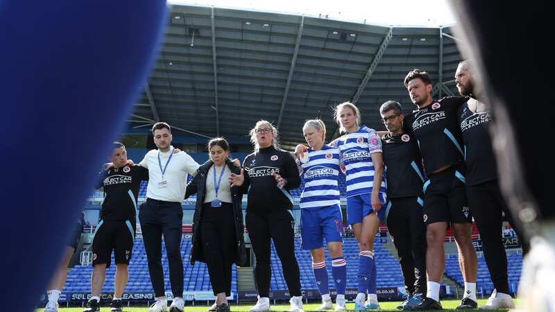 Kelly Chambers, Manager of Reading, speaks in a huddle after the team
