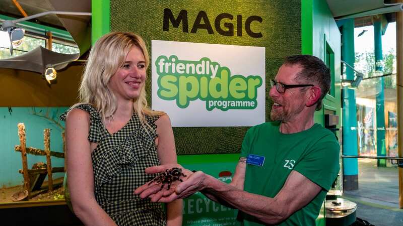 Lydia looks uncomfortable as Dave Clark holds out the furry spider (Image: David Dyson)