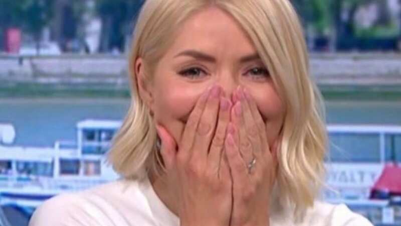 Holly got the giggles during a chat about Spam (Image: ITV)