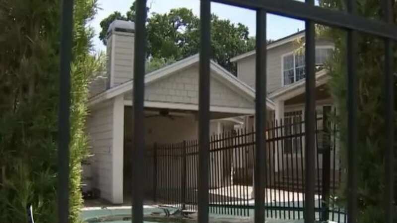 A neighbour built a fence through the middle of a swimming pool after a long-running boundary dispute (Image: YouTube/WFTV Channel 9)