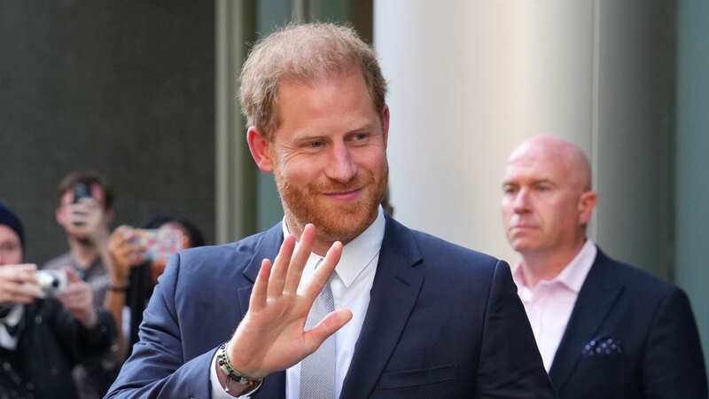 Prince Harry, Duke of Sussex, waves as he leaves after giving evidence at the Mirror Group Phone hacking trial (Image: Getty Images)