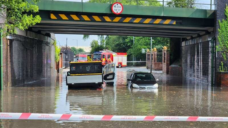 Sudden heavy rainfall left people trapped in cars submerged under bridges (Image: ASP/MEN MEDIA)