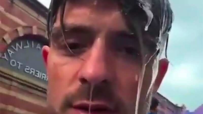 Grealish looks less than impressed as Haaland drenches him in champagne