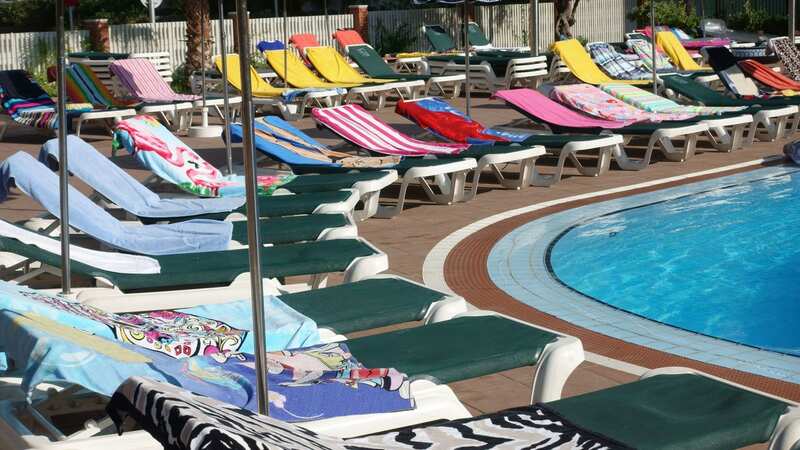 The holidaymakers were filmed securing the beds for a whole week (stock photo) (Image: Getty Images)