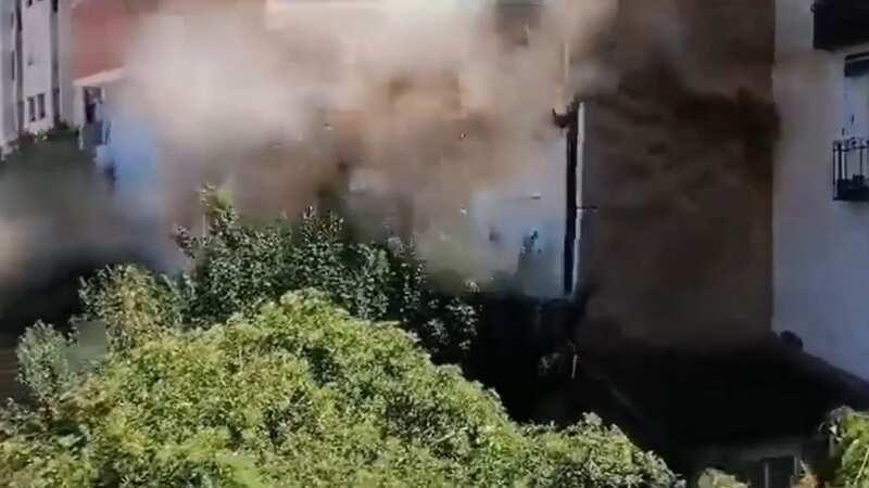 Terrifying moment five-storey building collapses seconds after being evacuated