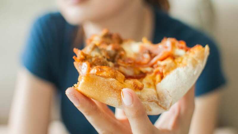 People were confused as to why the woman would eat pizza in such a way (Stock Image) (Image: Getty Images)