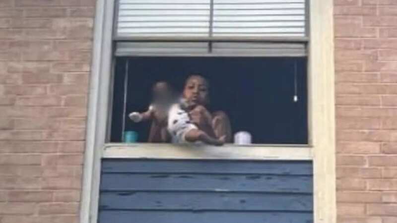 A Houston, Texas, mother allegedly dangled her four-month-old son out a third-story window on Friday (Image: The Harris County Constable)