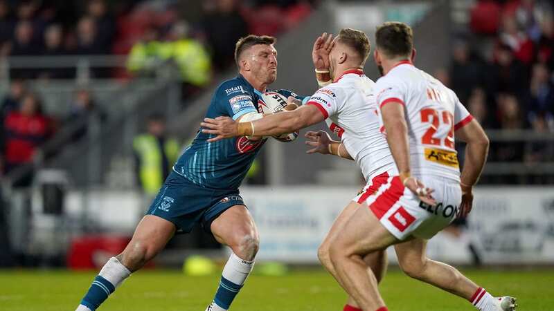 Josh McGuire is tackled by St Helens