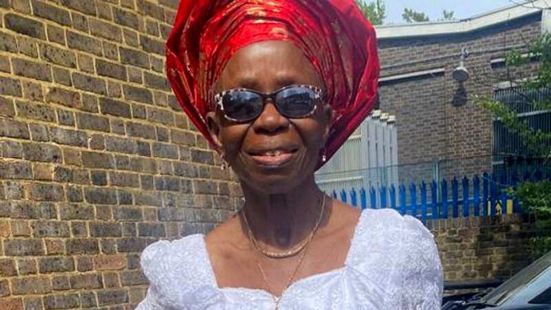 Nelly Akomah, 76, was found dead at the bottom of the stairs (Image: Metropolitan Police / SWNS)