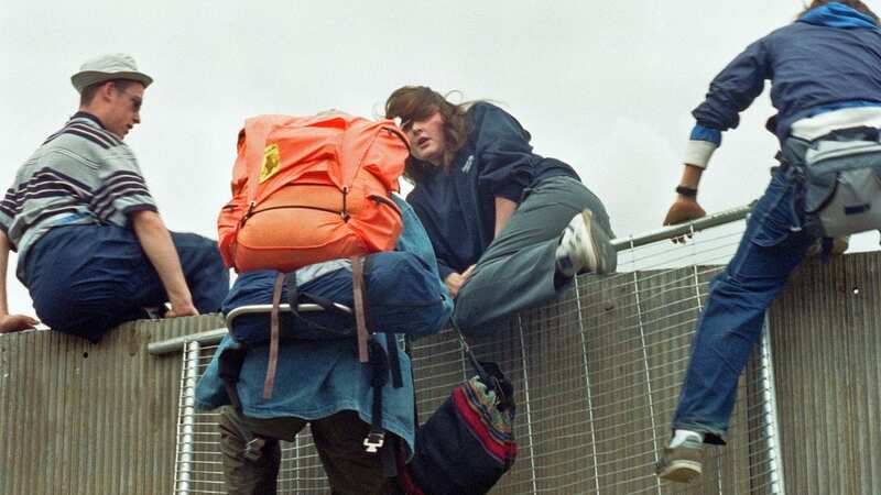 A security officers keeps a lookout at one of the watchtowers along Glastonbury