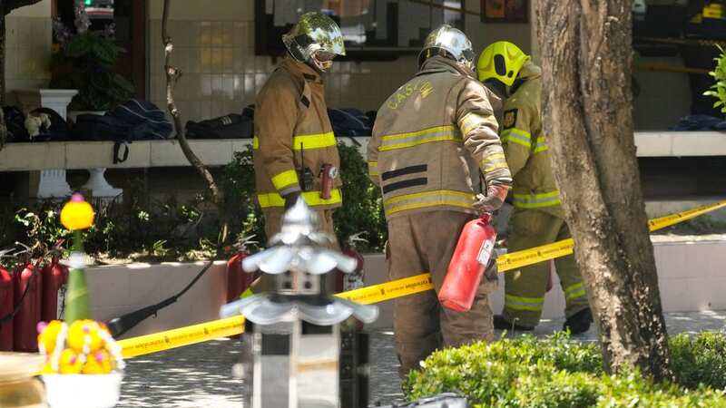 Firefighters investigate an explosion site at a school in Bangkok, Thailand (Image: AP)