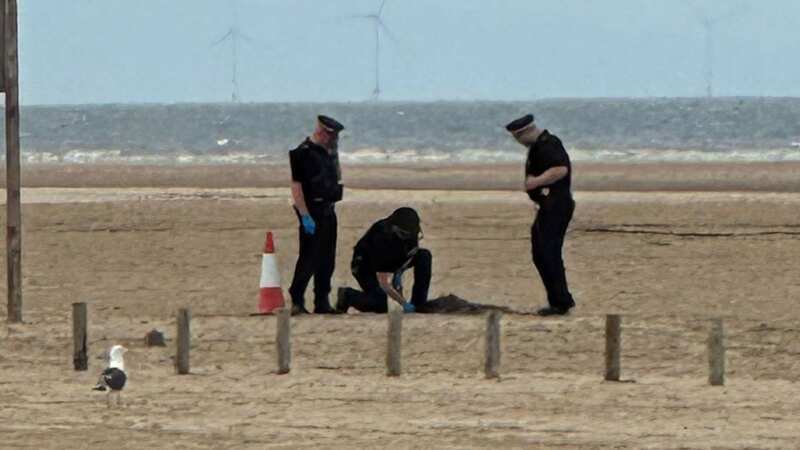 Police investigate part of Ainsdale beach after the public were evacuated earlier today (Image: David Raven / Reach PLC)
