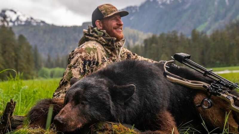 NFL quarterback Carson Wentz poses with dead bear in Alaska