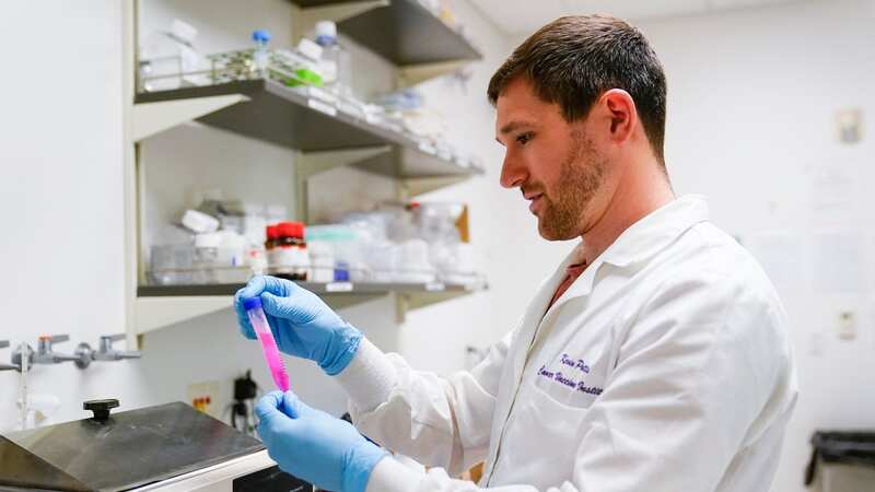 A research scientists checks on an enzyme which can dissociate ovarian cancer cells (Image: AP)