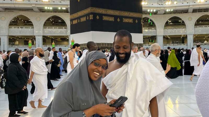Somalian pilgrims prepare for a selfie in front of the Kaaba (Image: AP)