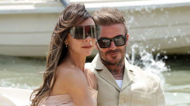 David Beckham cheekily grabs wife Victoria