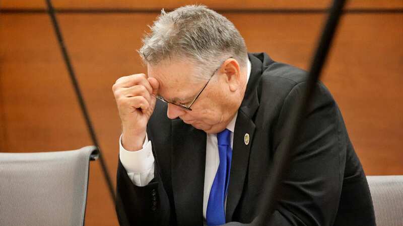 Cop accused of staying outside as shooter slaughtered 17 kids weeps in dock