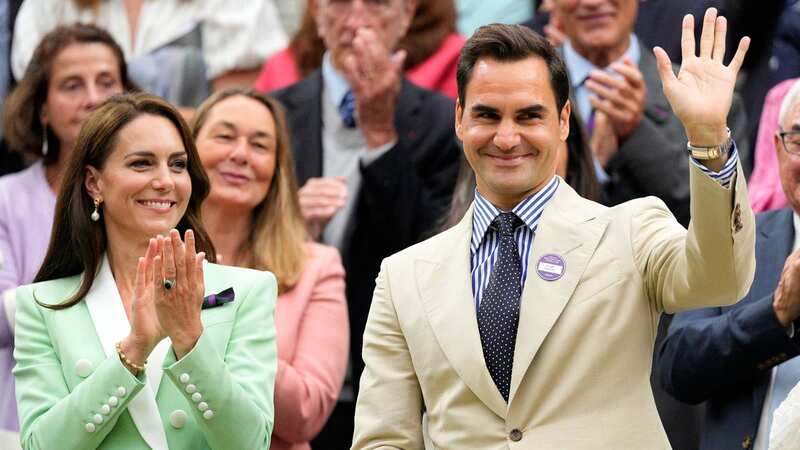 Roger Federer takes his place next to Princess of Wales Kate Middleton in the Royal Box (Image: WireImage)