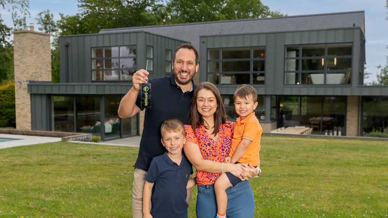 Will Satherley and wife Carrie with their two sons outside the dream property