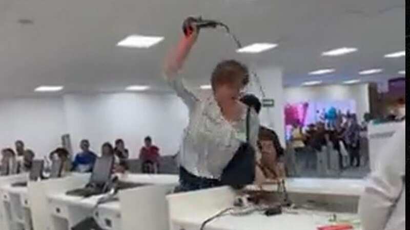 Furious passenger rages at airport ticket counter as she smashes up computers