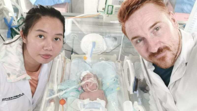 DanDan and Matthew are sent pictures of their baby twice a week