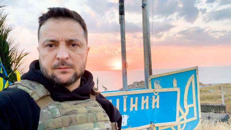 Zelensky visits island where soldiers told Russian warship to go 