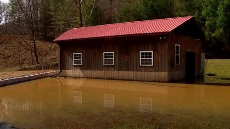 Furious resident builds dam to flood neighbour