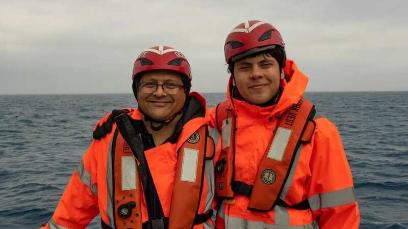 Pakistani billionaire Shahzada Dawood, 48, and his 19-year-old son Suleman are pictured arm in arm and appear excited to board the sub (Image: NYT)
