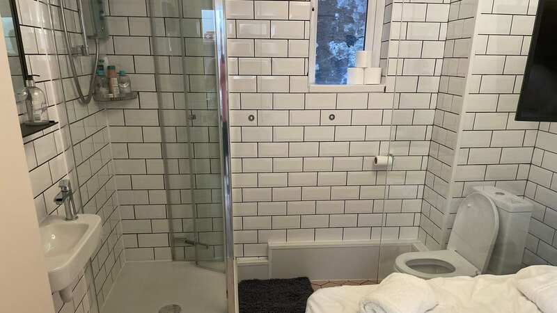 The bed was right next to the toilet - and the shower (Image: Jam Press/David Holtz)