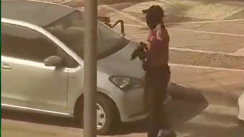 Moment tourists flee as man fires sub-machine gun on packed restaurant