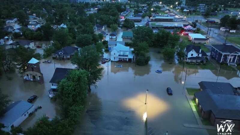 Flash flooding emergency as neighbourhoods turned into rivers and cars submerged