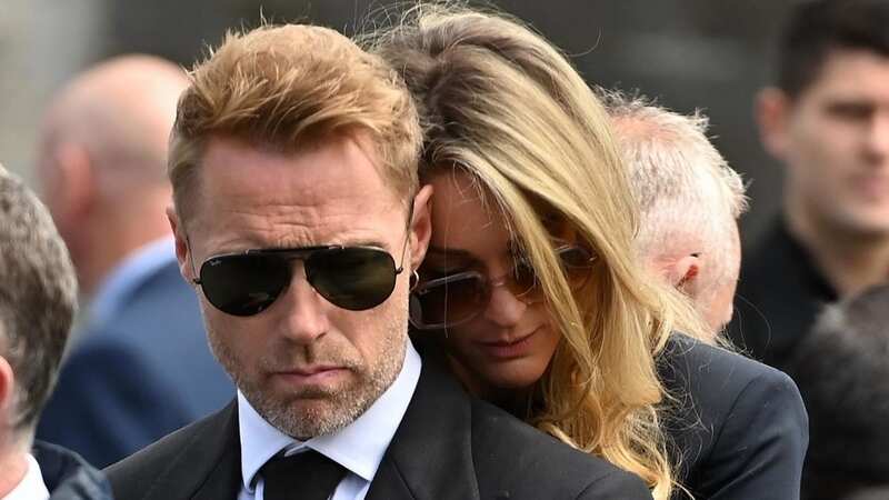 Emotional Ronan Keating supported by wife Storm at brother