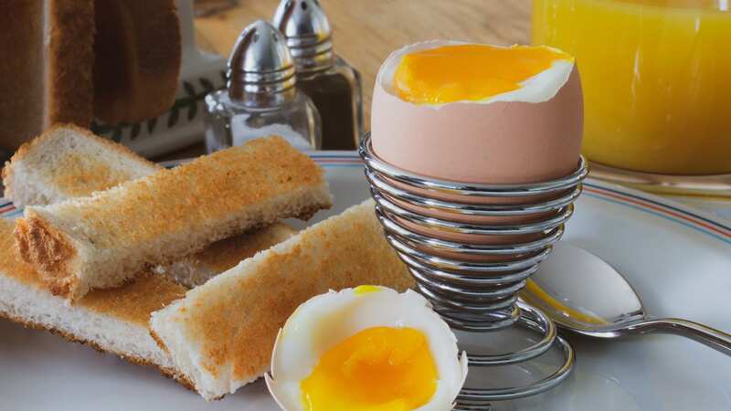 Breakfast, soft boiled egg, toast soldiers, fresh orange juice and salt and pepper. (Image: Getty Images)