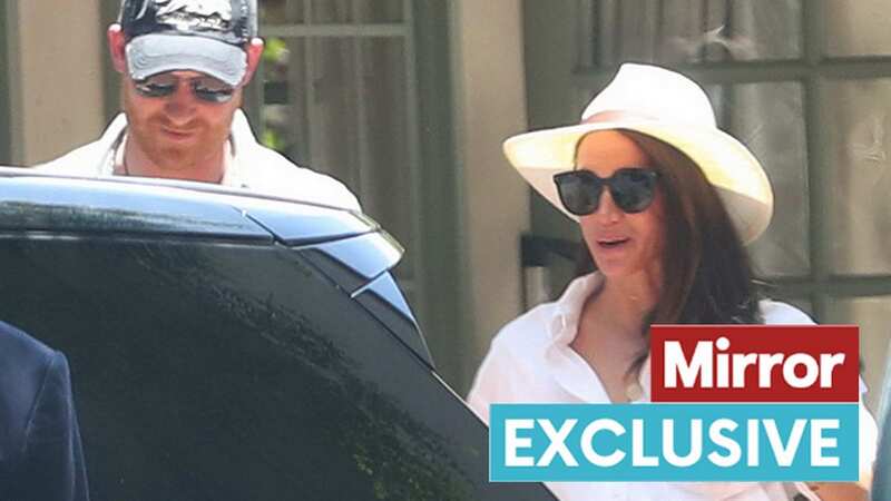 Harry and Meghan leaving an office in Santa Barbara (Image: BACKGRID)
