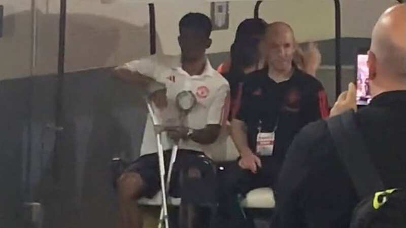 Amad Diallo was seen leaving the stadium on crutches (Image: @samuelluckhurst/Twitter)