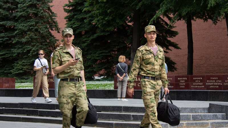 Soldiers walk just outside the Kremlin after President Vladimir Putin addressed the Russian military personnel and employees of law enforcement agencies in June (Image: Vlad Karkov/SOPA Images/REX/Shutterstock)