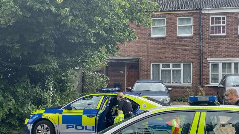 Police outside the property (Image: PA)