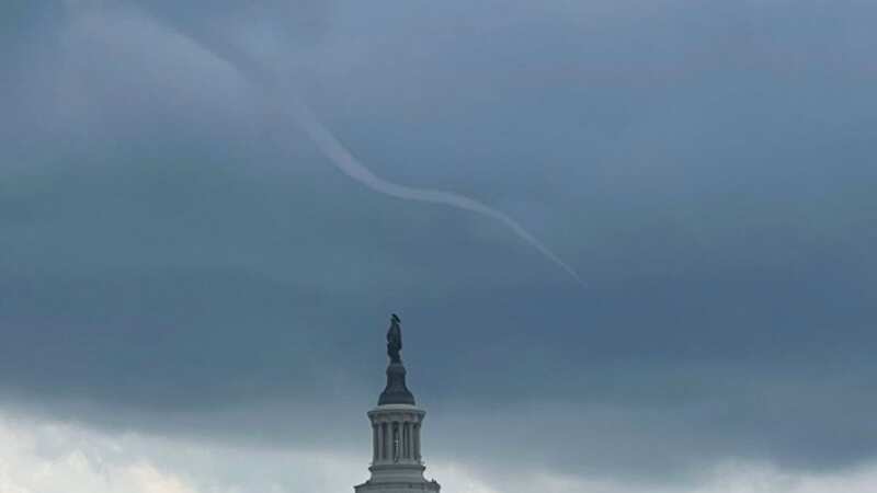 A funnel cloud looms over the White House, causing the public to speculate on the cause (Image: Twitter)