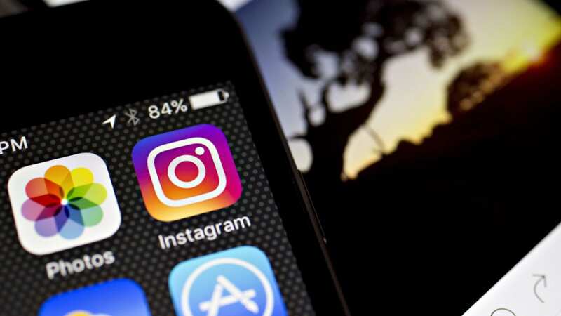 Millions of us like to take pictures on our phone, share them on our socials and then put them on saving software (Image: Bloomberg via Getty Images)