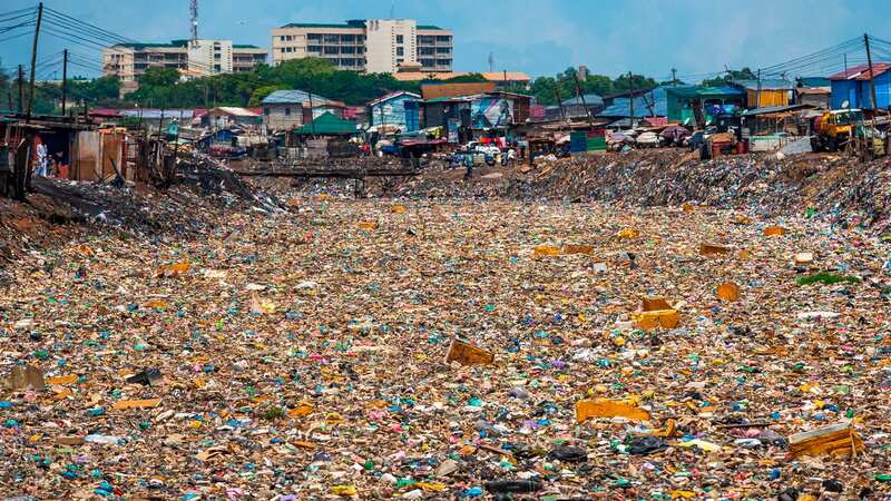 In the Ghanaian capital of Accra, the Odaw River is now said to be virtually dead, with clothing waste and discard (Image: Adam Gerrard / Daily Mirror)